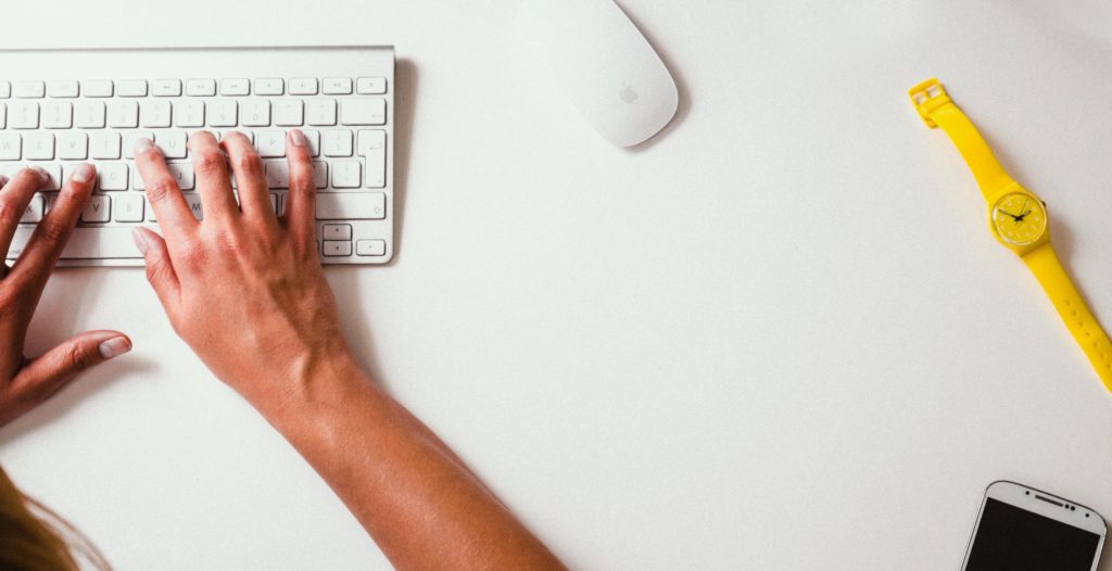 hands on a white keyboard